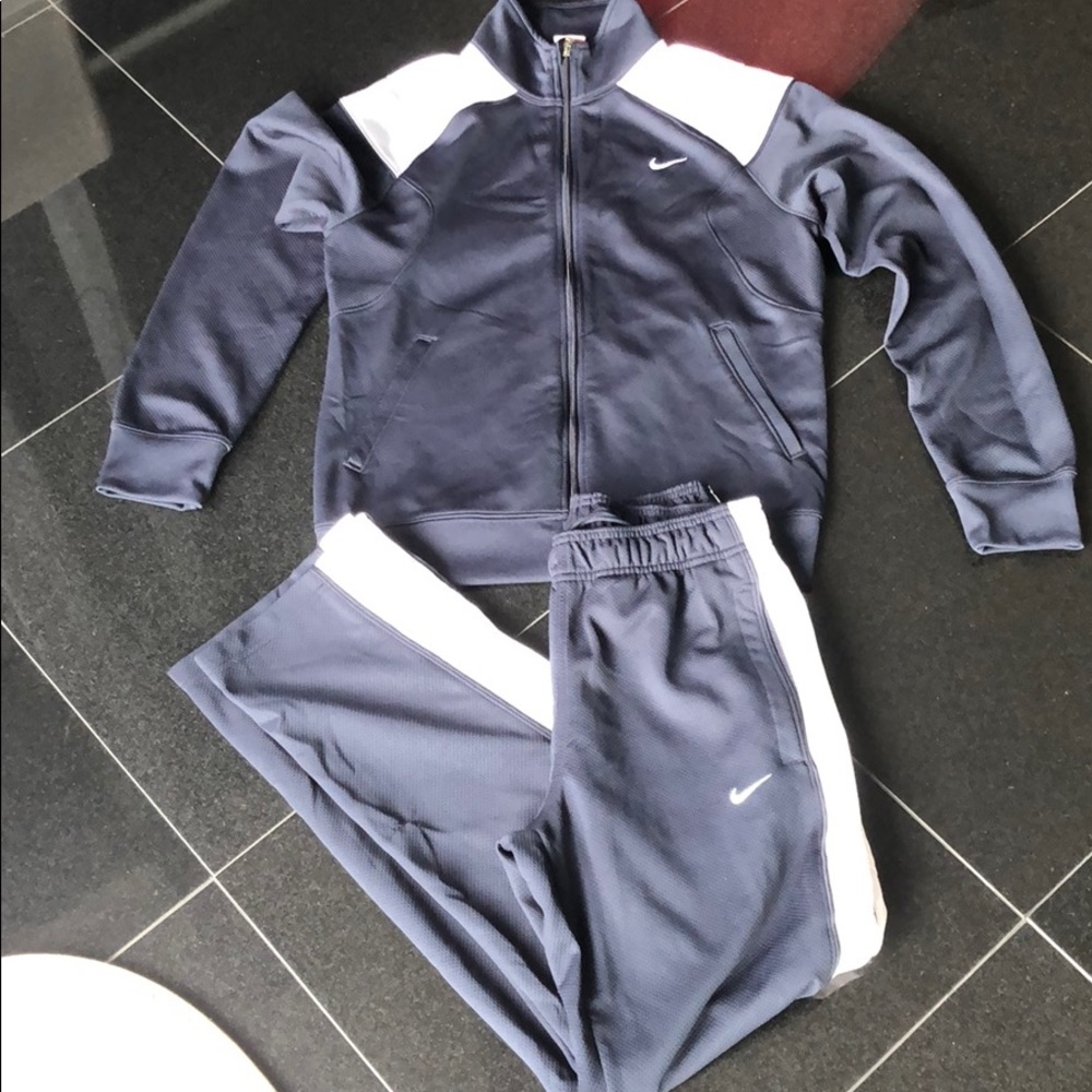 Small Nike tracksuit. Navy blue white and gray.